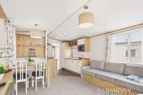 Bright open-plan living, dining and kitchen area.