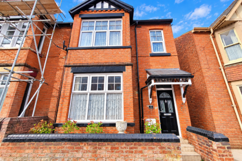 Bright Red-Brick Terraced House Facade