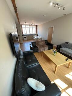 Bright and welcoming living room featuring comf...