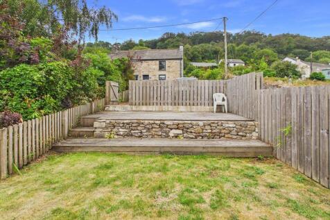 Garden to Front behind parking