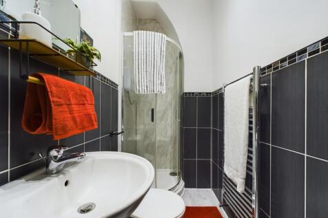 A modern and clean bathroom featuring stylish t...