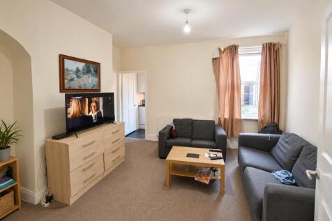 Spacious lounge with comfy sofas and large TV...