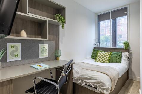 Bright modern bedroom with dedicated study spac...