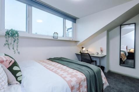 Bright double bedroom with modern study area...