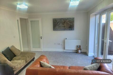 Bright Tv Area With Patio Doors To Rear Garden