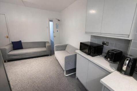 Bright and modern social space with sofas...