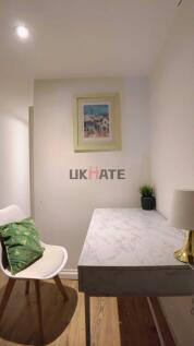 A well-maintained bedroom featuring a stylish c...