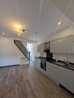 Modern sleek kitchen with stylish wood flooring...
