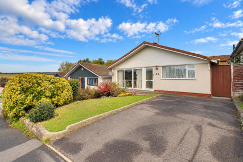 Sunny Bungalow with Lush Front Garden.png