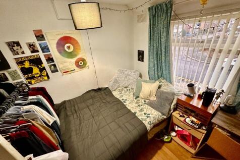 Cozy double bedroom with a comfortable bed, bed...