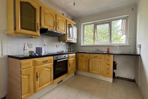 Bright kitchen with classic wooden cabinetry...