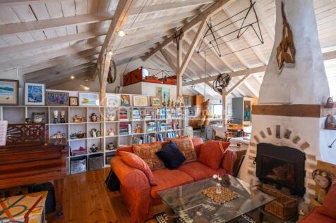 Stairs to sitting and kitchen