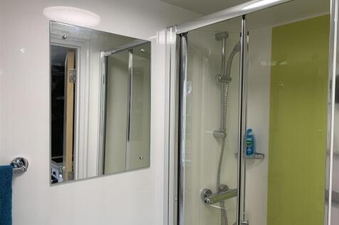Modern shower cubicle with sleek glass doors...