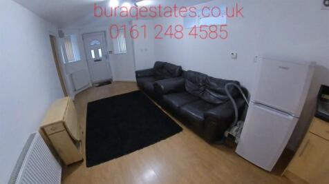 Neat living room with laminate flooring, a comf...