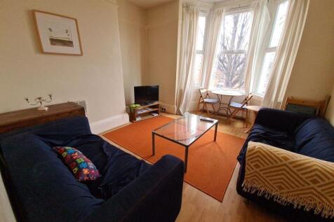 A welcoming living room featuring two comfortab...