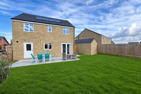 Sunny Suburban Garden with Stone House.png