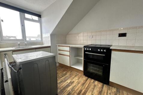 Bright kitchen with modern oven and wood floors...