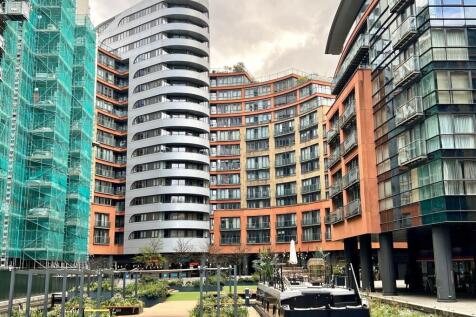 Modern urban complex with vibrant garden square...