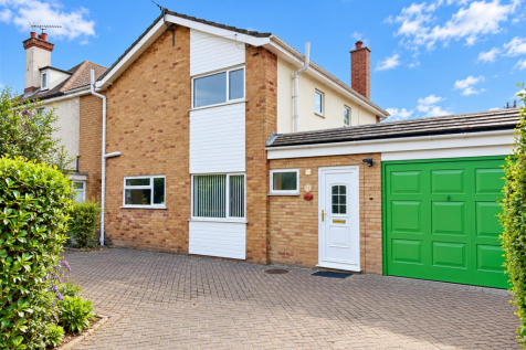Bright Suburban Brick Home Exterior.png