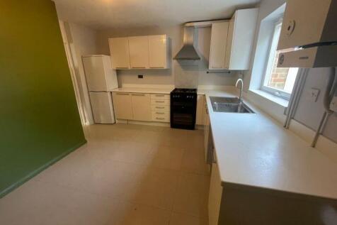 Spacious modern kitchen with ample counter spac...