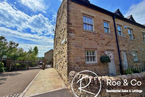 The property and gated entrance to the courtyard