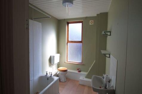 Bright and clean bathroom with natural light st...