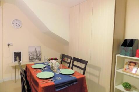 Cozy dining area with a neatly set table for fo...