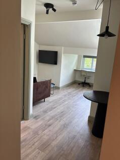 Bright modern living area with integrated study...