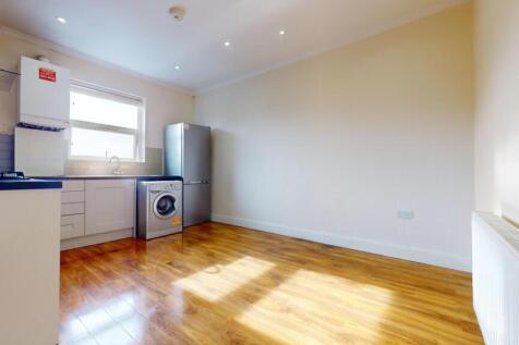 Bright open-plan kitchen with fitted cabinets, ...