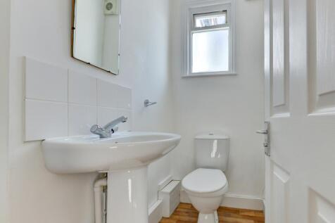 Bright, well-maintained bathroom with a modern ...