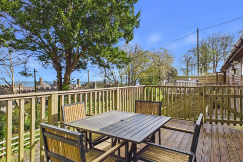 Outdoor Dining Area On The Lodge Decking With Coas