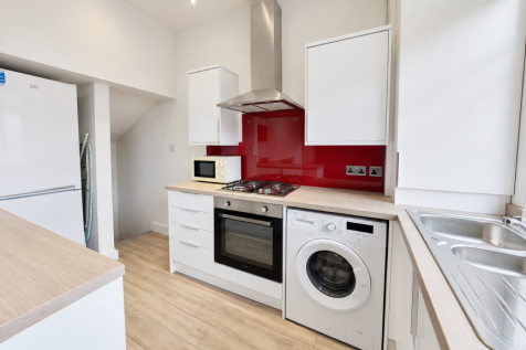 Bright Modern Kitchen with Red Splashback