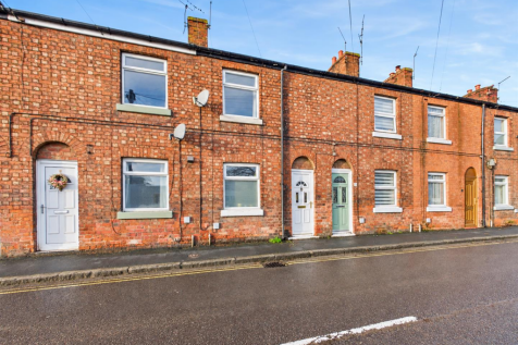 Victorian Terraced Houses on a Bright Street.png