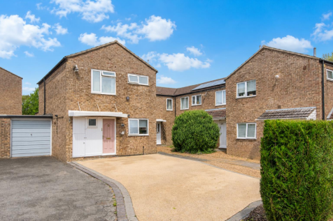 Sunny car-free UK home exterior.png