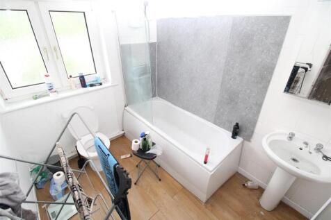 Bright bathroom with bathtub and natural light...