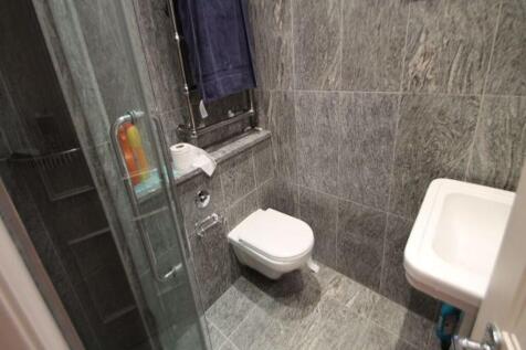 A clean and functional bathroom with a washing ...