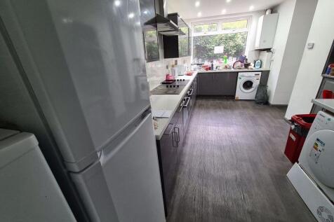 Bright and modern kitchen featuring ample count...