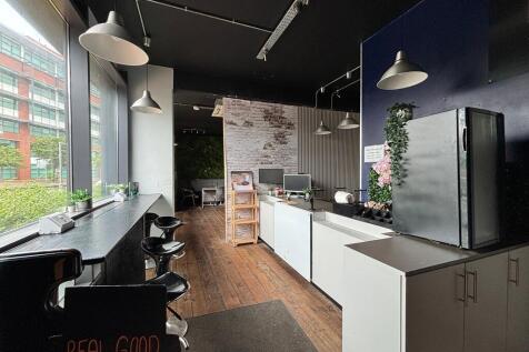 Modern communal lounge with bright window seati...