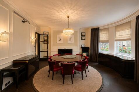 Spacious living room with elegant dining area...