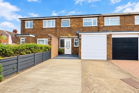 Bright Brick Terraced House with Driveway.png