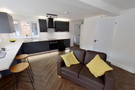 Modern open-plan kitchen with breakfast bar...