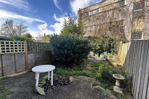 Private paved garden with sunny patio area...