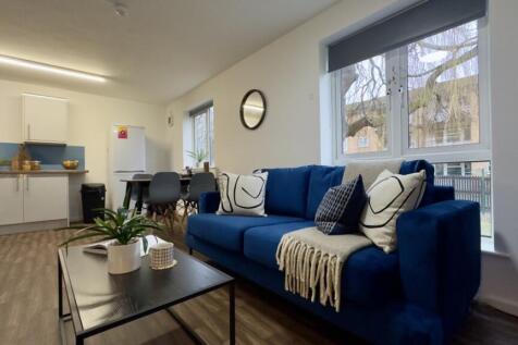 A spacious and inviting modern living room with...