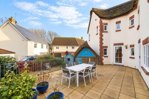 Bright Cottage Patio with Blue Planters.jpg