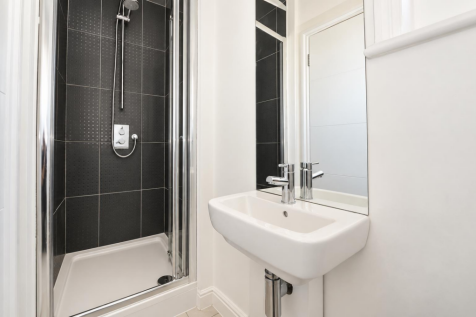 Modern Ensuite with Charcoal Tiled Shower.png