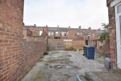 A spacious outdoor area that offers potential f...