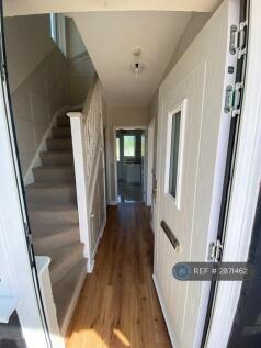 Front Door Leading Into Hallway And Staircase