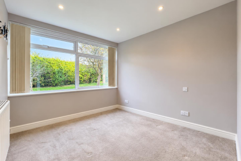 Bright Minimalist Room with Garden View.png