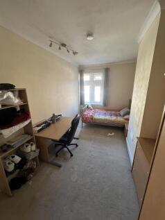 Spacious bedroom with dedicated study area...