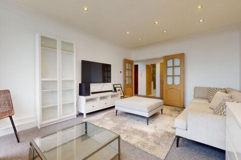 Bright and spacious modern living area with TV...